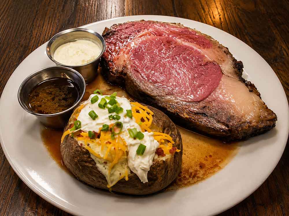 Ribeye steak with baked potato at Tin Top Restaurant in Bon Secour Alabama